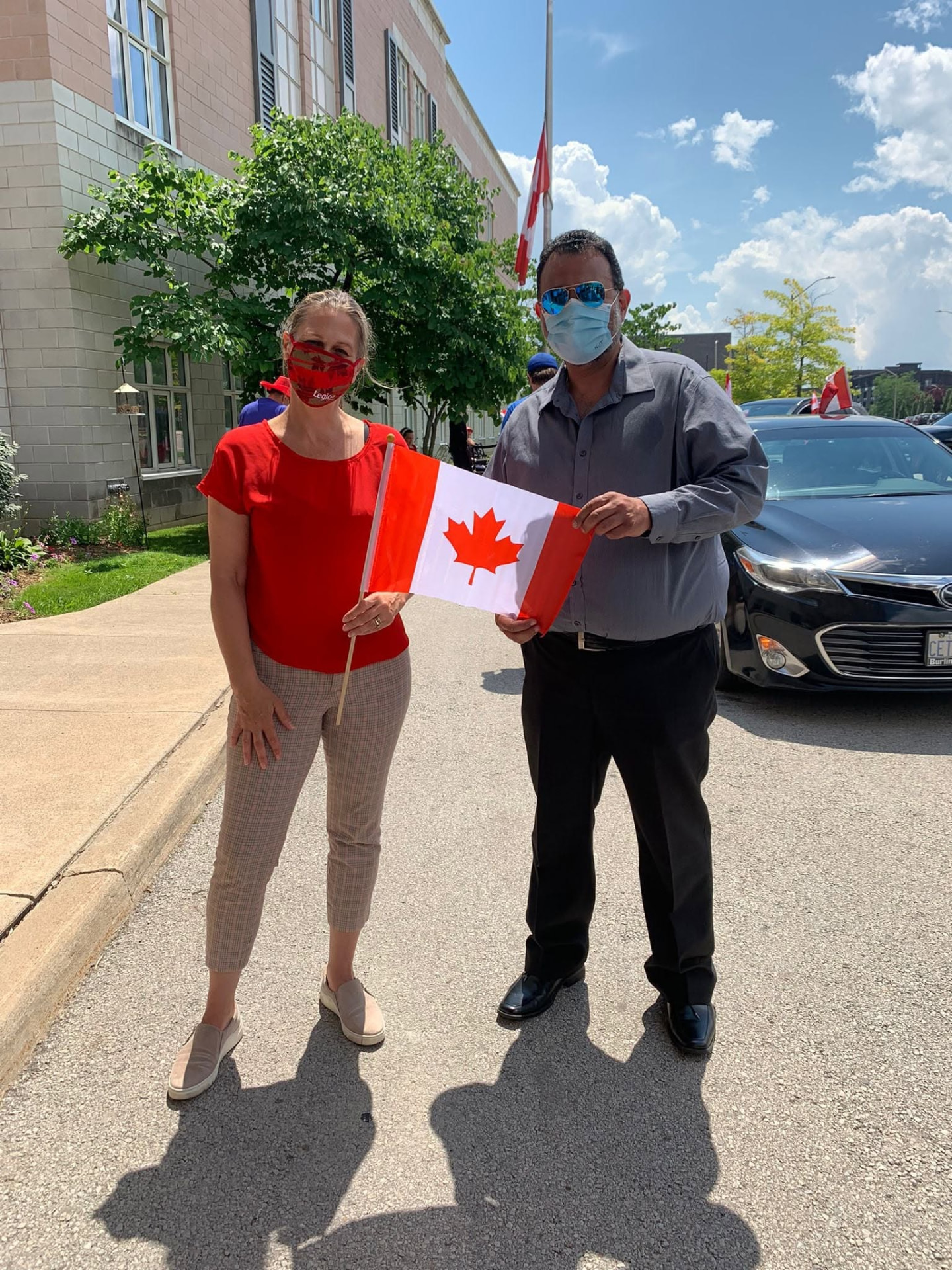 Amir Henry celebrating Canada Day with a community member