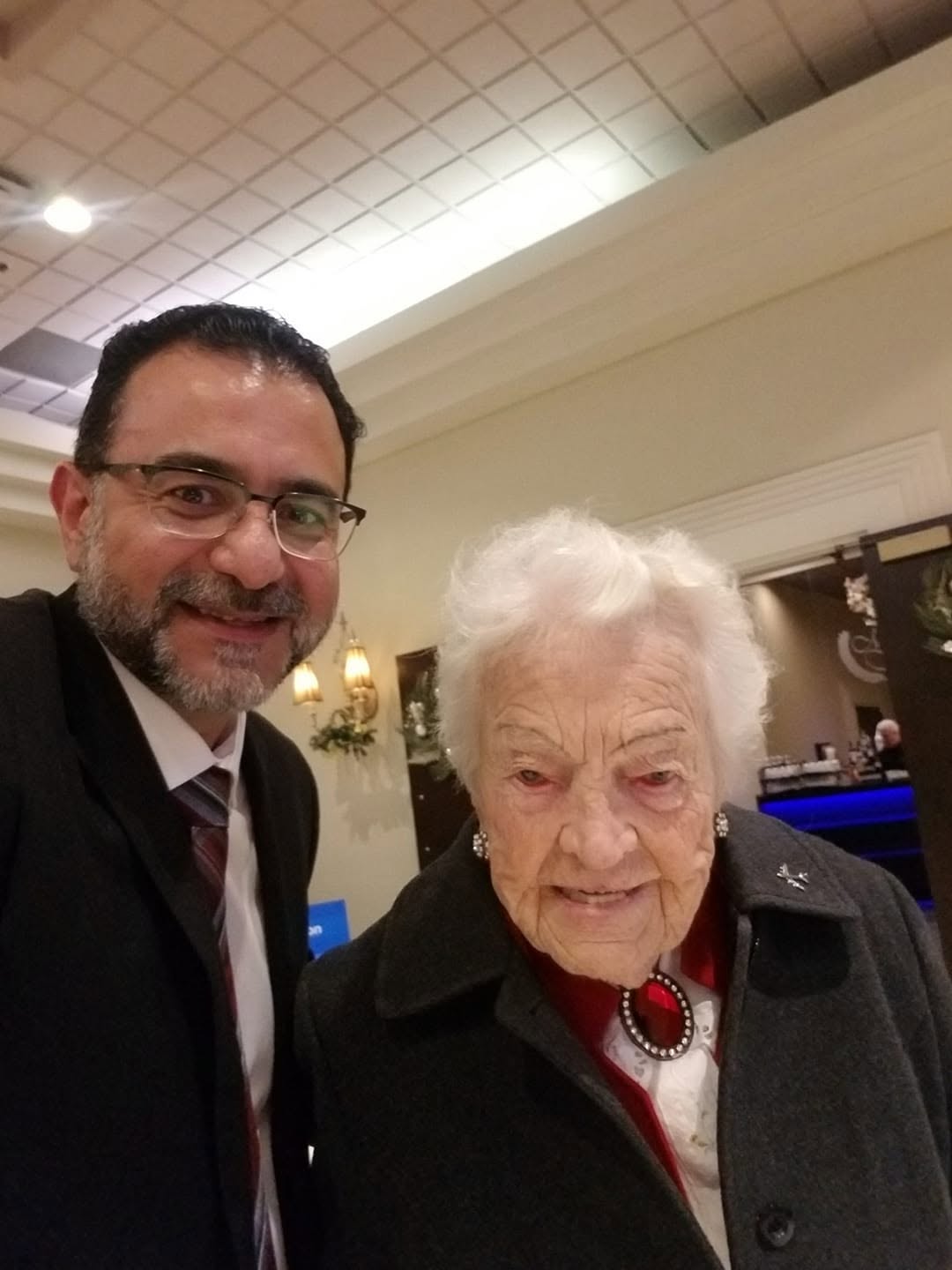 Amir Henry with a community elder at a local celebration