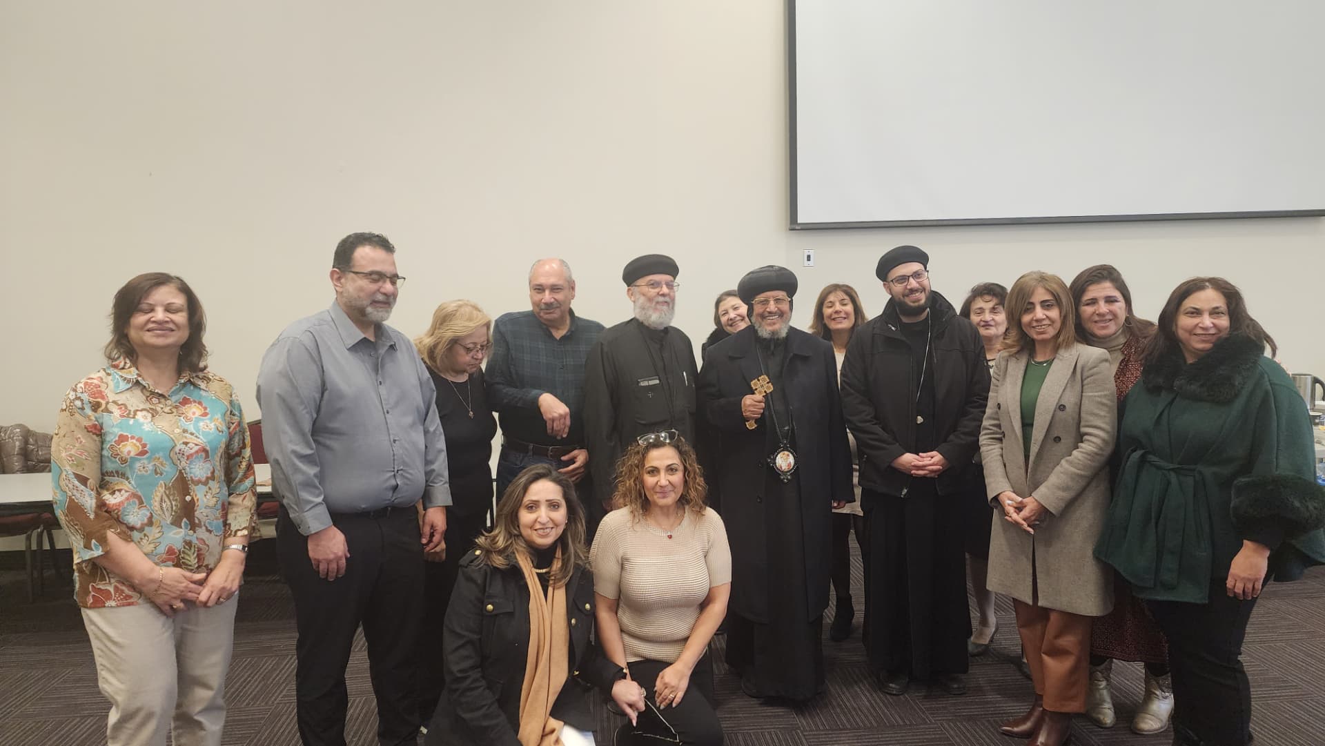 Amir Henry with community members at a Coptic church gathering