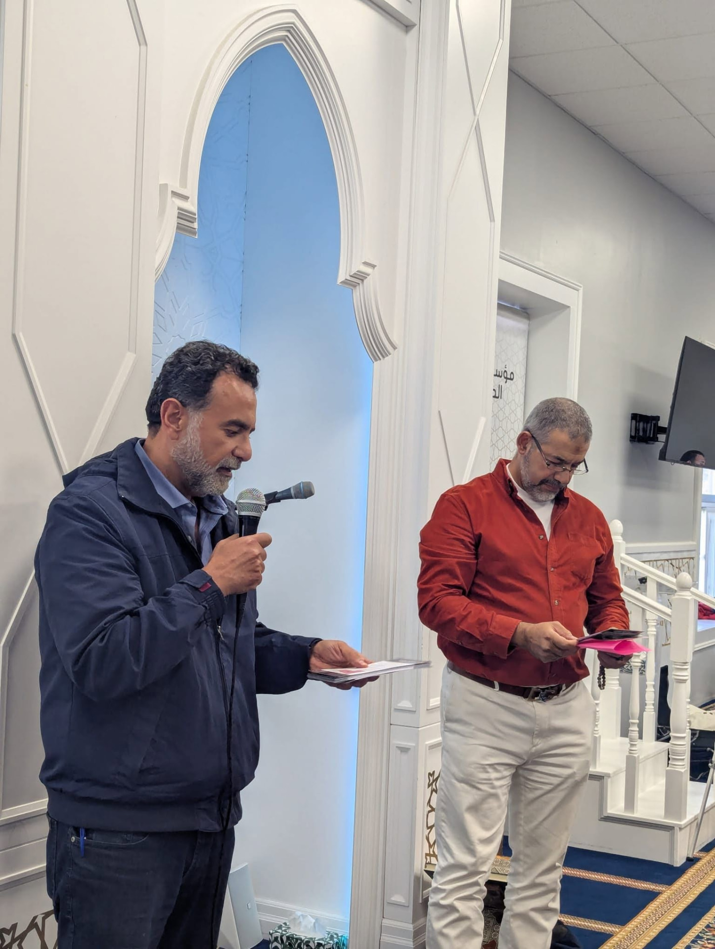 Amir Henry speaking at a mosque gathering