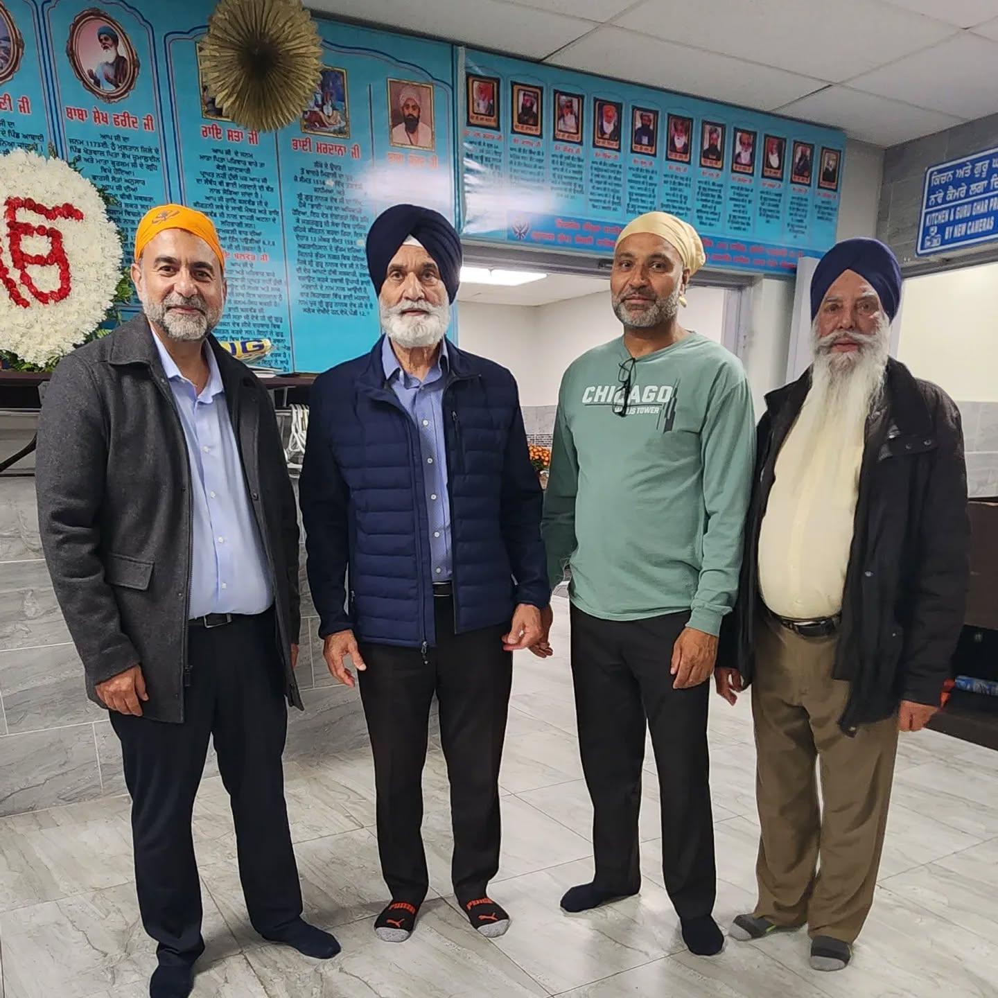 Amir Henry with community members at the Gurdwara