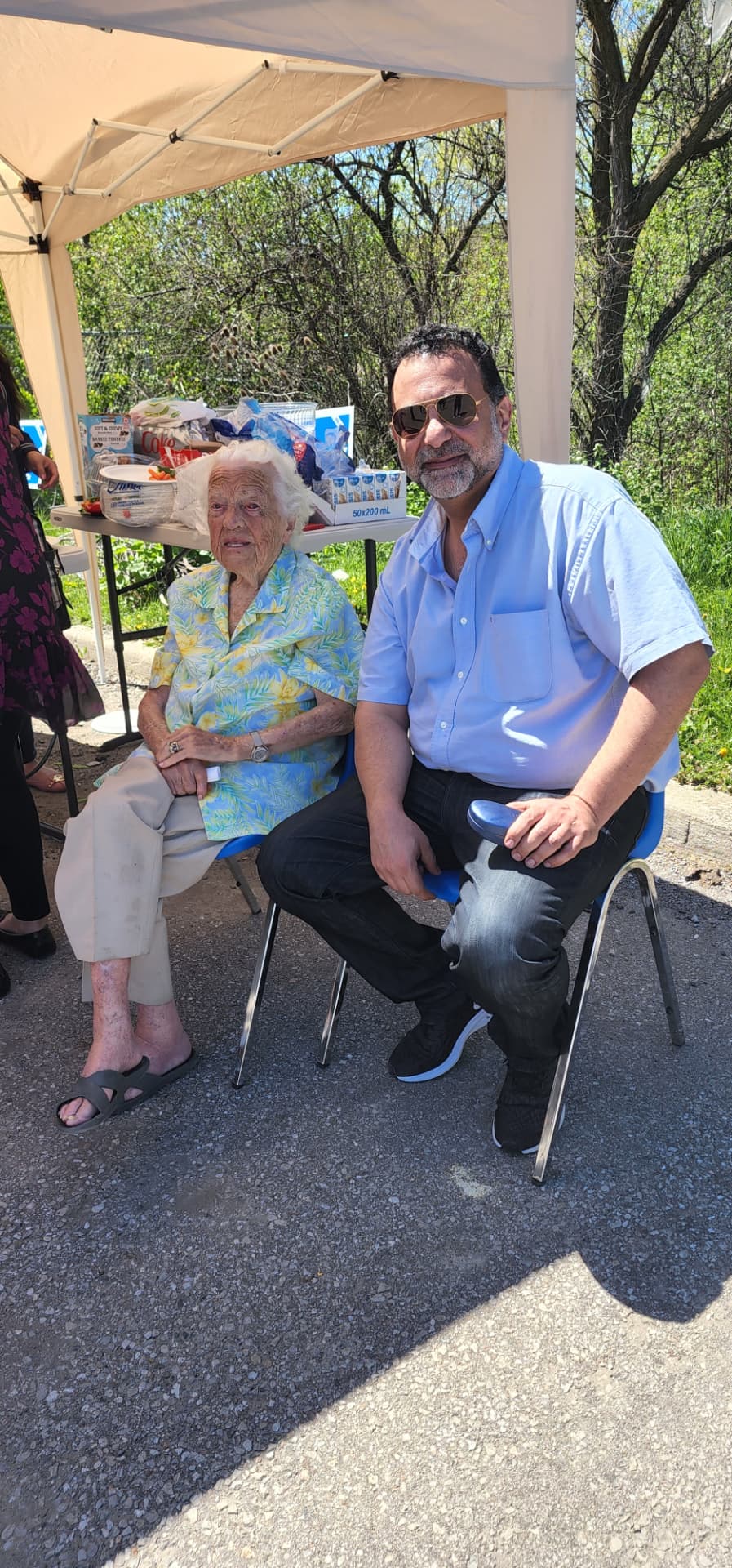 Amir Henry with a community elder at a spring event